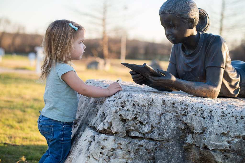 Girl with statue